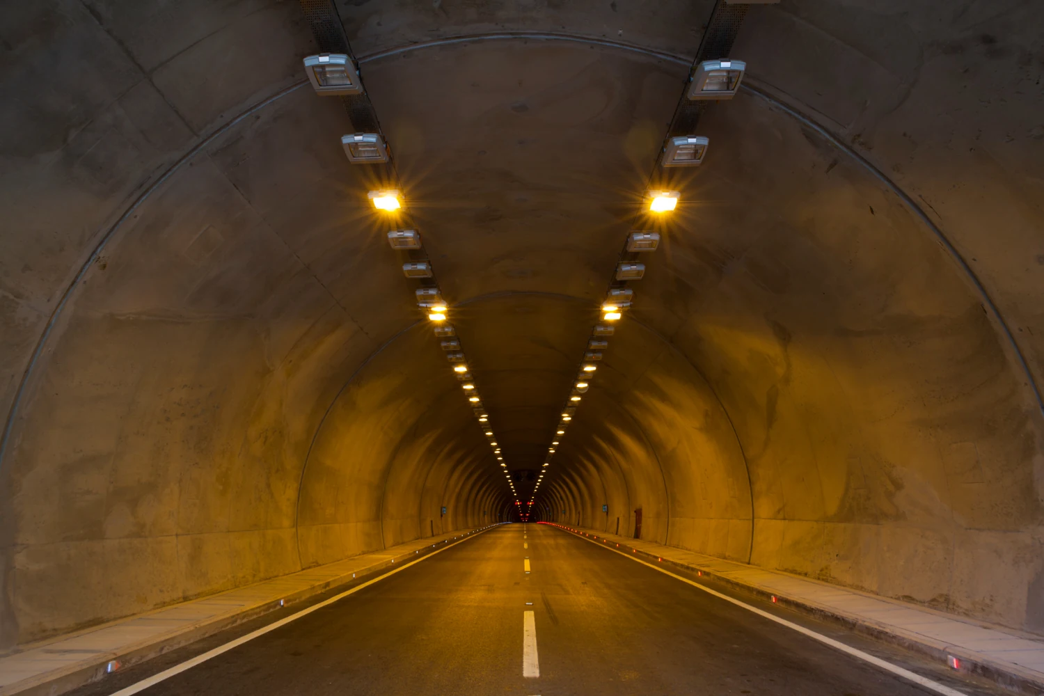 An enclosed road tunnel without direct satellite reception